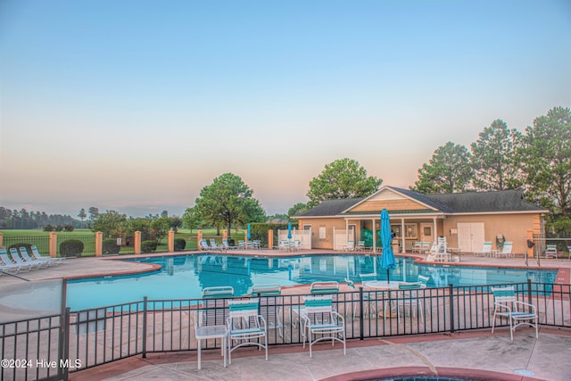 pool featuring a patio area and fence