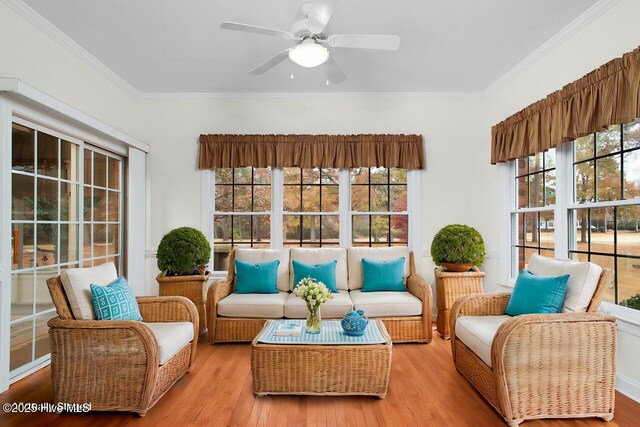 bedroom featuring light colored carpet and ceiling fan