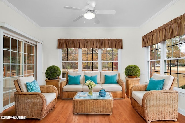 sunroom featuring ceiling fan