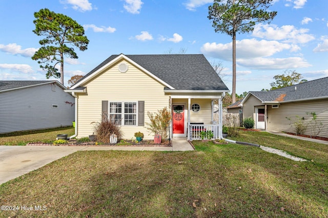 bungalow-style home with a porch and a front yard