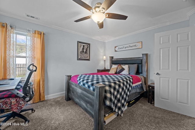 carpeted bedroom with ceiling fan and ornamental molding