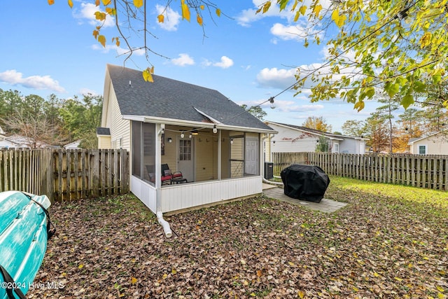 back of property with a sunroom and cooling unit