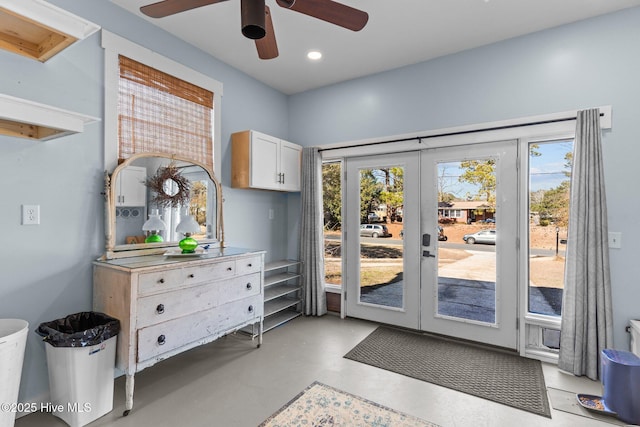 doorway to outside featuring a wealth of natural light and ceiling fan