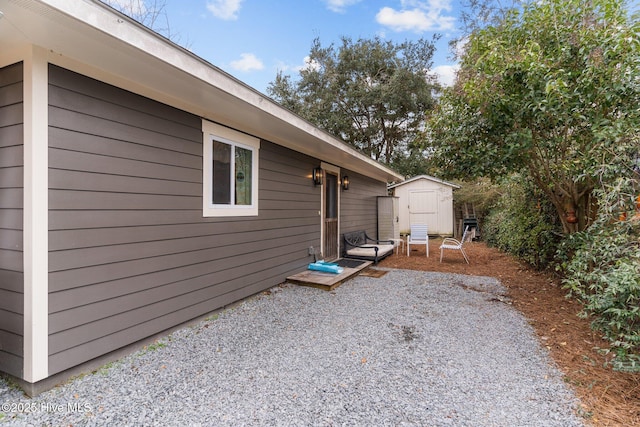 exterior space with a patio area and a shed