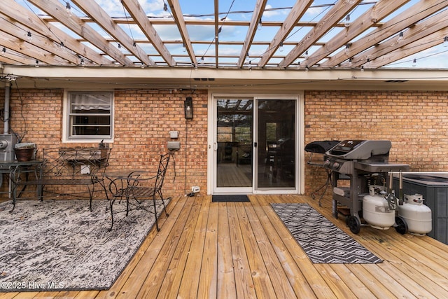 deck featuring area for grilling and a pergola