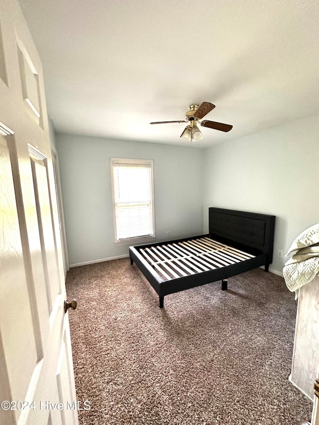 bedroom featuring ceiling fan and carpet floors