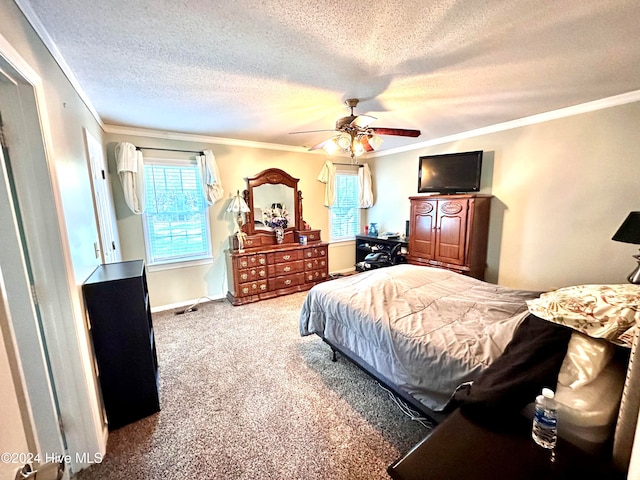 carpeted bedroom with a textured ceiling, ceiling fan, and crown molding