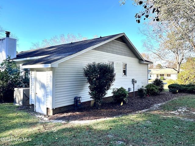 view of home's exterior with a yard