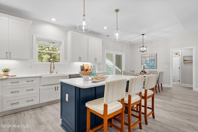 craftsman-style home featuring covered porch, a garage, and a front yard