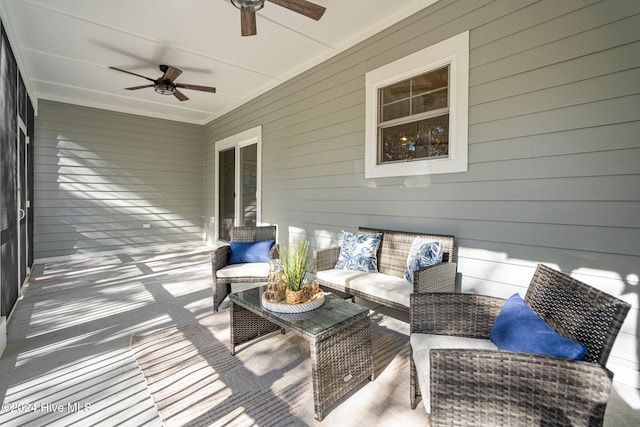 wooden terrace with an outdoor hangout area