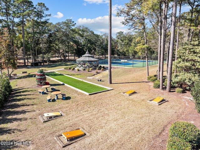 surrounding community with a gazebo and tennis court