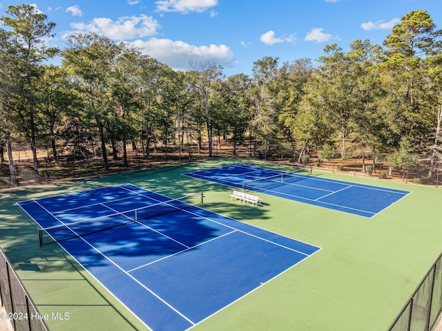 view of tennis court featuring basketball court