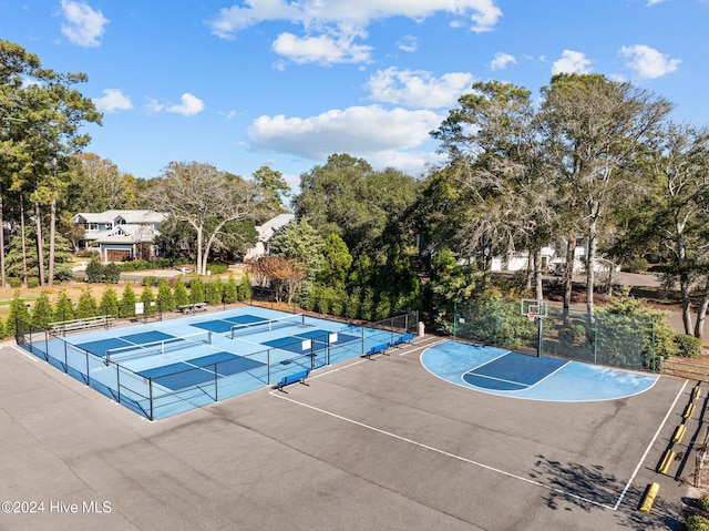 view of swimming pool featuring basketball hoop and tennis court