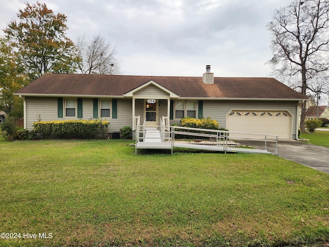 ranch-style home featuring a garage and a front yard