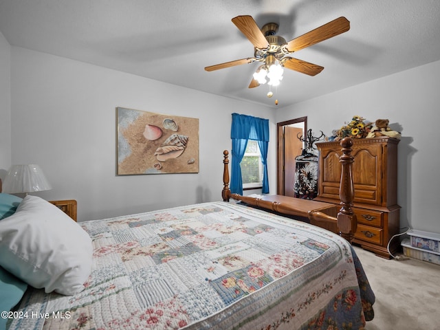 bedroom featuring ceiling fan and light carpet