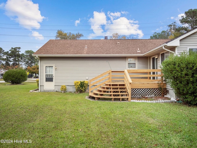 exterior space with a deck and a yard