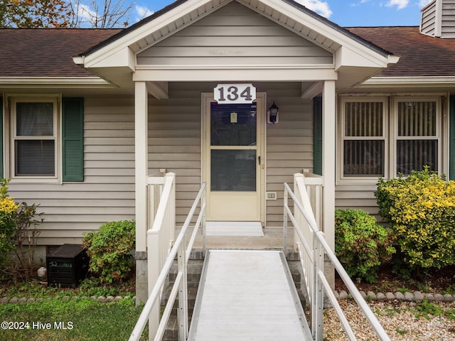 single story home featuring a front yard and a garage