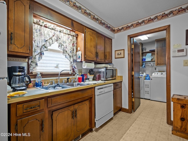 kitchen with light carpet, electric stove, ceiling fan, kitchen peninsula, and washer / clothes dryer