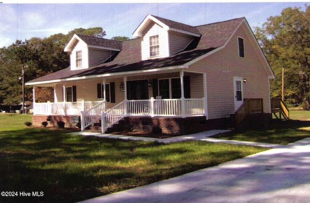 cape cod house with a porch and a front lawn