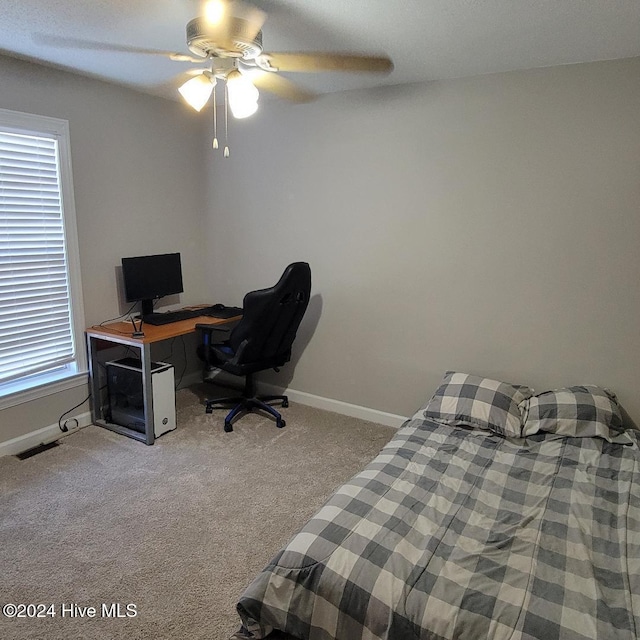 bedroom with ceiling fan and light colored carpet