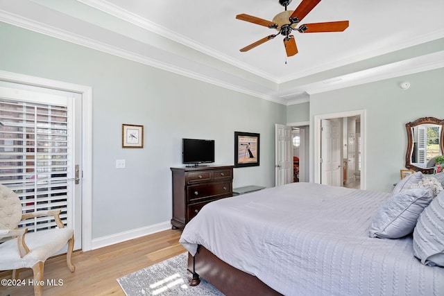 bedroom with ornamental molding, light wood-type flooring, ensuite bathroom, and ceiling fan