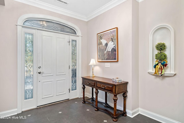 entryway featuring crown molding