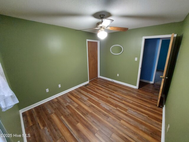 bathroom with toilet, a shower with shower door, and vanity