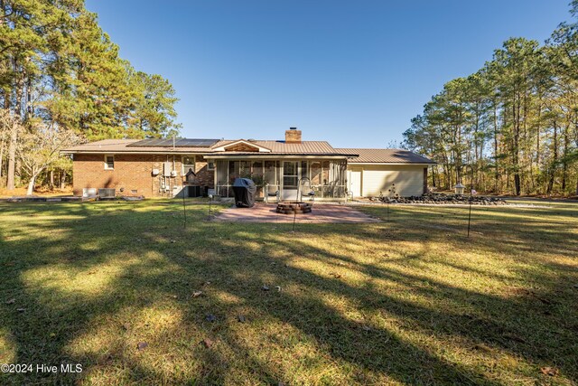 exterior space featuring a yard and a carport