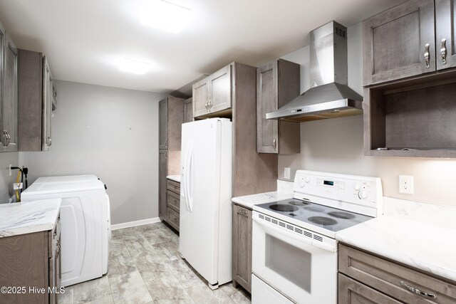 laundry area with cabinets and washing machine and clothes dryer