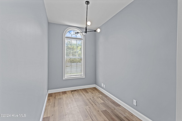 spare room with light hardwood / wood-style floors