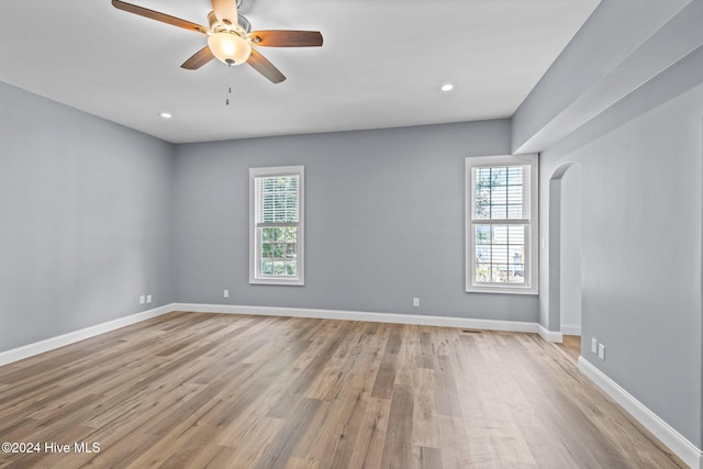 unfurnished room featuring ceiling fan and light hardwood / wood-style flooring