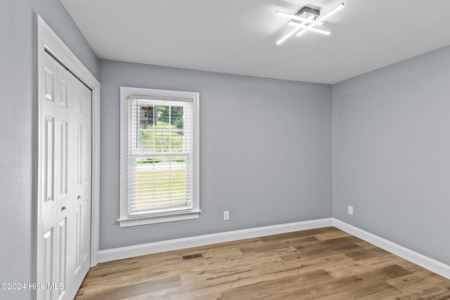 empty room with light wood-type flooring