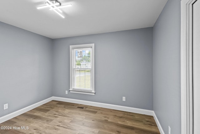 spare room featuring light hardwood / wood-style flooring