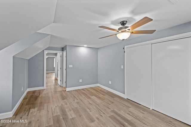 additional living space with ceiling fan, light hardwood / wood-style floors, and lofted ceiling