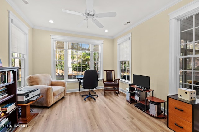 office space featuring crown molding, ceiling fan, and light hardwood / wood-style floors