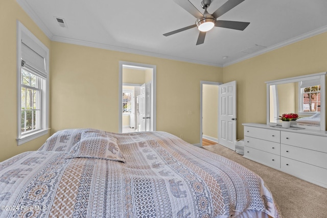 bedroom featuring light colored carpet, multiple windows, crown molding, and ceiling fan