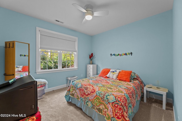 bedroom featuring ceiling fan and light colored carpet