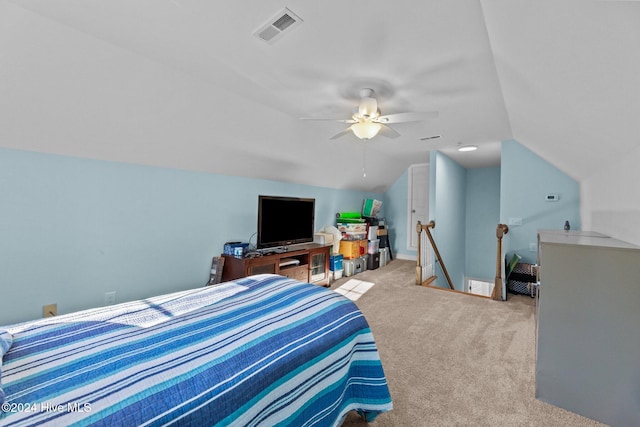 carpeted bedroom with vaulted ceiling and ceiling fan