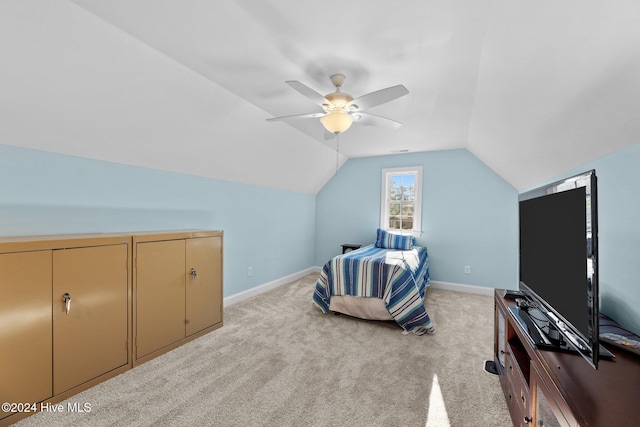 carpeted bedroom featuring ceiling fan and lofted ceiling