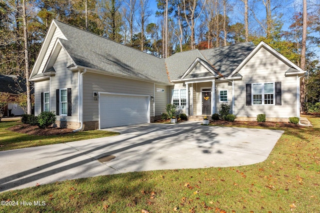 view of front facade featuring a front yard and a garage