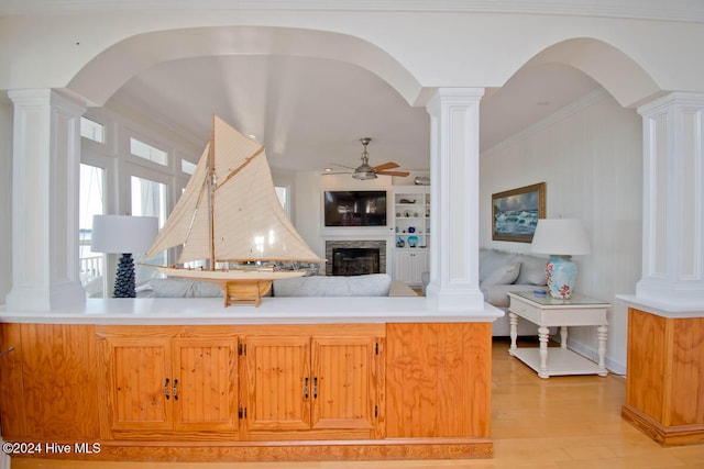 kitchen with ceiling fan, light hardwood / wood-style floors, and ornamental molding