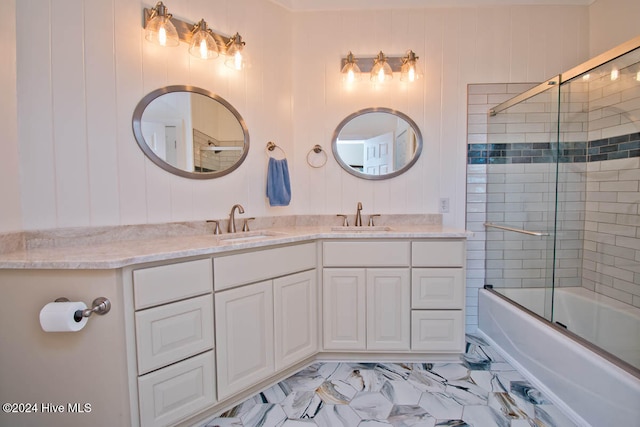 bathroom with vanity and bath / shower combo with glass door