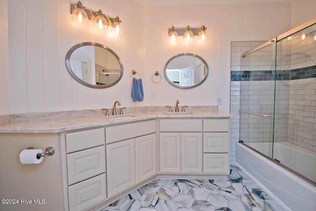 105 Wind Dance Ln, Swansboro, NC 28584 - full bathroom featuring double vanity, combined bath / shower with glass door, and marble look tiles