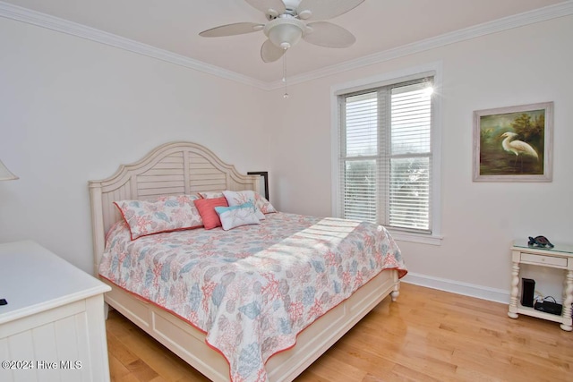 105 Wind Dance Ln, Swansboro, NC 28584 - bedroom featuring light wood-style floors, ornamental molding, baseboards, and a ceiling fan