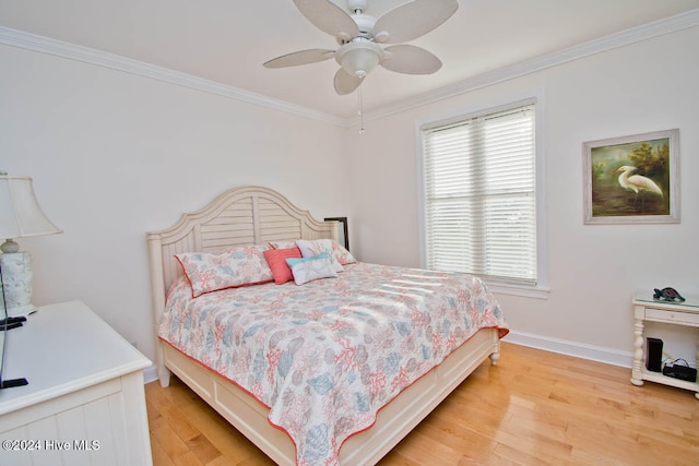 bedroom with ceiling fan, wood-type flooring, and ornamental molding