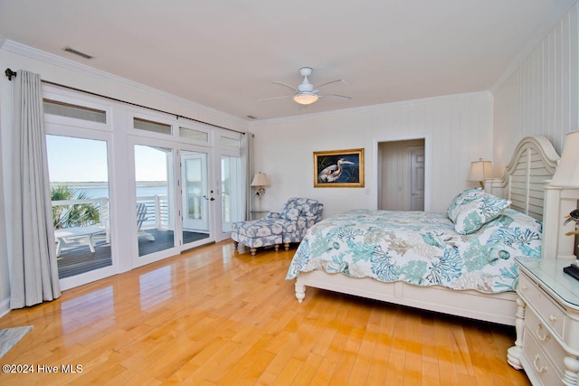 bedroom featuring access to exterior, ceiling fan, light wood-type flooring, and ornamental molding