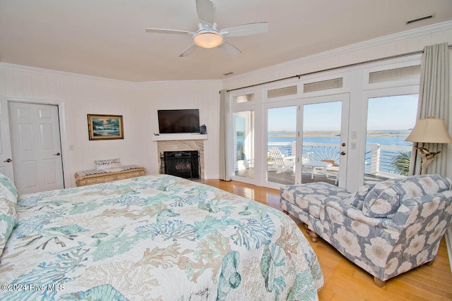 bedroom featuring access to exterior, ceiling fan, light hardwood / wood-style floors, and ornamental molding