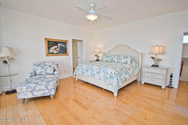 bedroom featuring ceiling fan, wood-type flooring, and crown molding