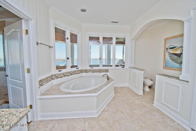 105 Wind Dance Ln, Swansboro, NC 28584 - bathroom featuring a jetted tub, crown molding, plenty of natural light, toilet, and vanity
