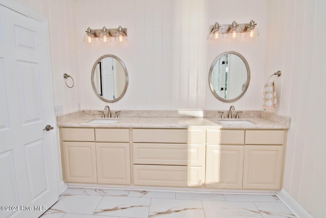 105 Wind Dance Ln, Swansboro, NC 28584 - bathroom with marble look tiles, double vanity, baseboards, and wooden walls
